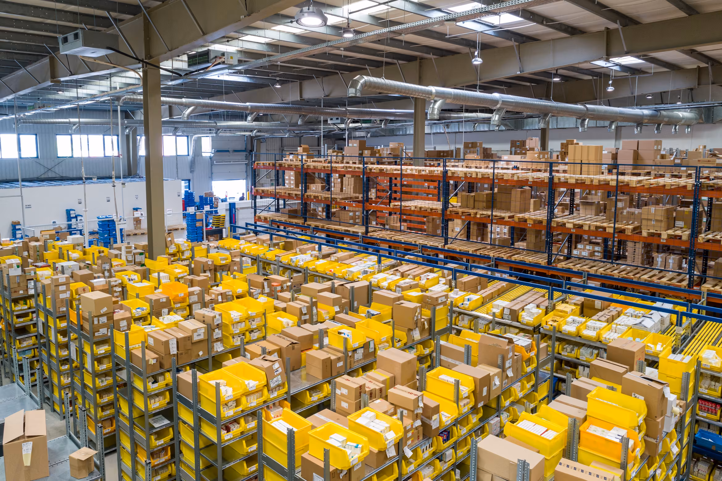 Tall warehouse shelves stacked with boxes